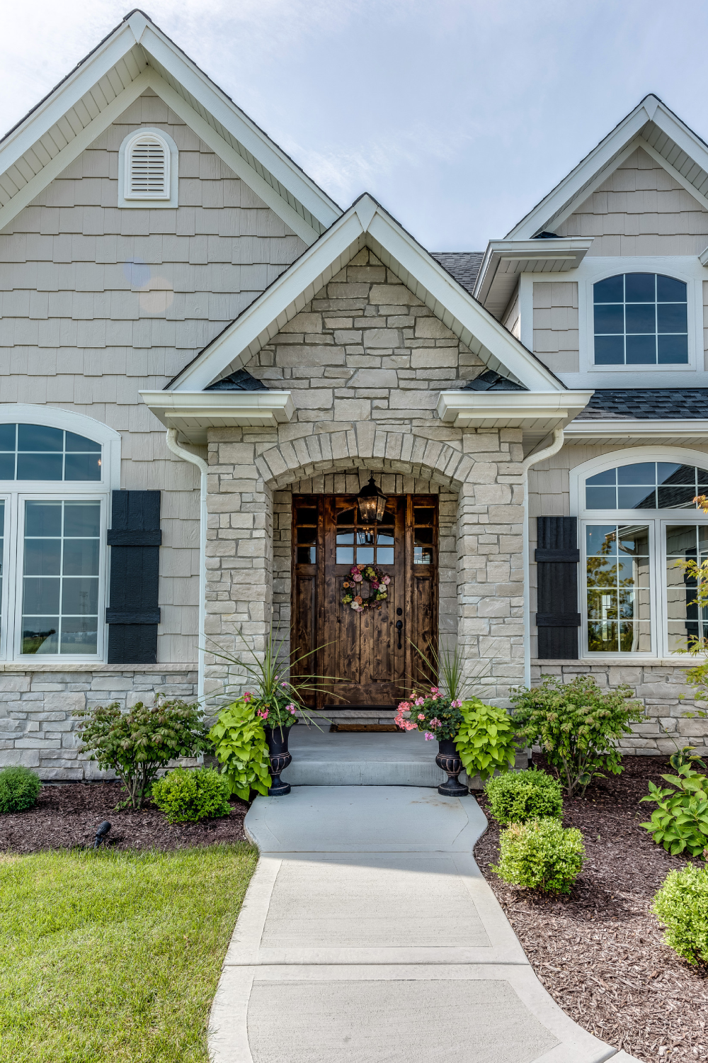 Large luxurious newly built home with grand porch and entrance